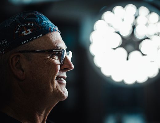 Medical professional administering treatment to patient.