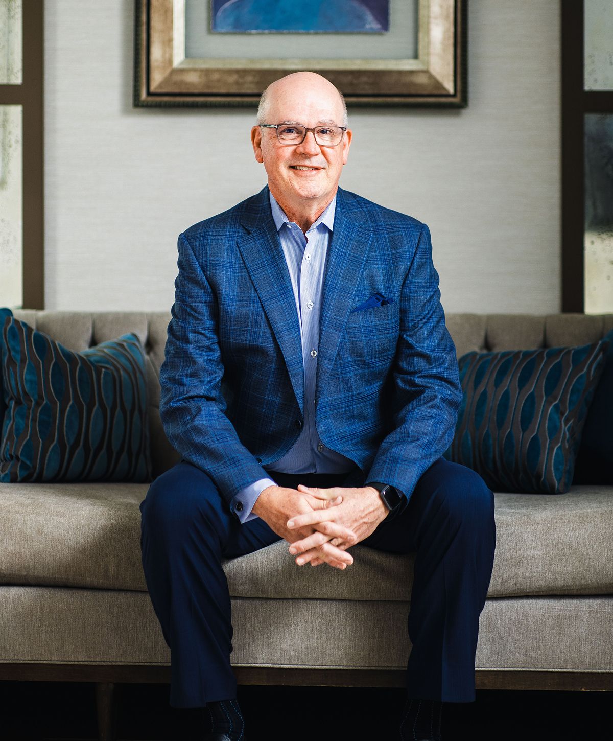 Woman smiling, holding oversized jeans, healthy lifestyle.