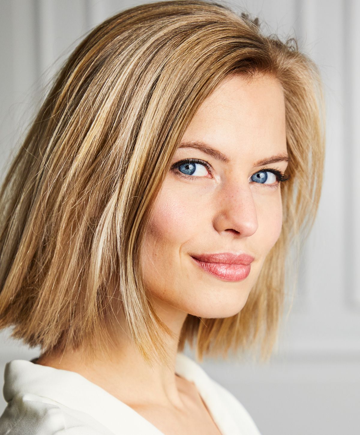 Portrait of a woman with blonde hair.